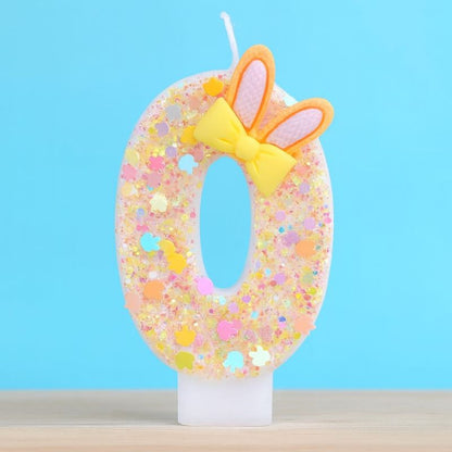 Bougie Anniversaire Douce Fantaisie, le chiffre représenté est le 0 et sur fond bleu.