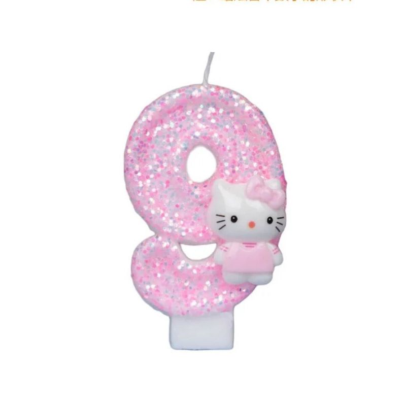 Bougie Anniversaire Girly, de couleur rose à paillette, le chiffre est le 9 et sur fond blanc.