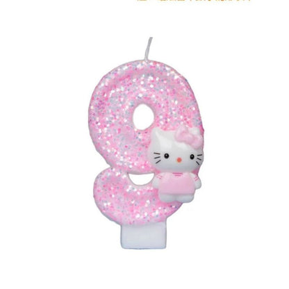 Bougie Anniversaire Girly, de couleur rose à paillette, le chiffre est le 9 et sur fond blanc.