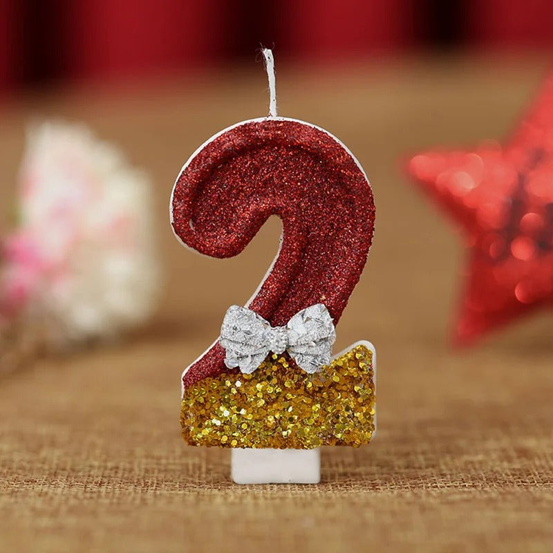 Bougie Anniversaire Style Glamour, le chiffre de la bougie est le 2, de couleur doré et rouge.