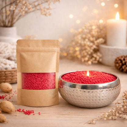 Bougie cire perle rouge bol argenté avec recharge en sachet décoratif, ambiance cosy.
