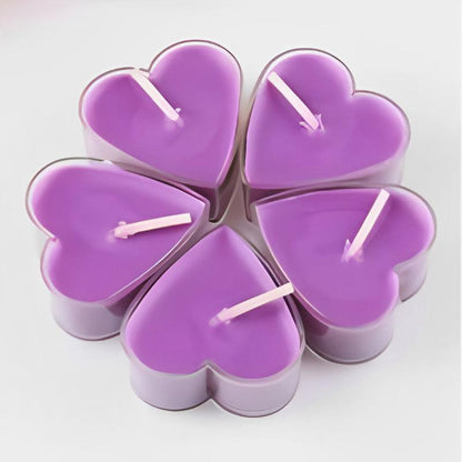 Bougie Décorative Chauffe Plat Cœur Lot 9 pièces, de couleur violette et sur fond blanc cassé.