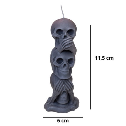 Bougie Halloween Décor Macabre, en forme de tête de mort et de couleur grise, avec ses dimensions et sur fond blanc.