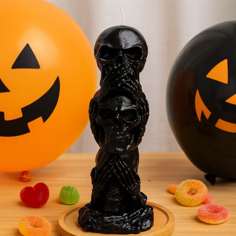 Bougie Halloween Décor Macabre, de couleur noire, avec des ballons et des bonbons, ambiance d'Halloween.