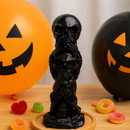 Bougie Halloween Décor Macabre, de couleur noire, avec des ballons et des bonbons, ambiance d'Halloween.