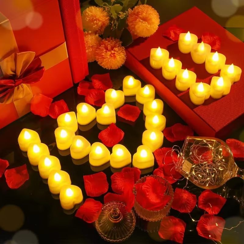 Bougie LED Chauffe Plat Cœur, disposés sur un table et allumées. Ambiance romantique.