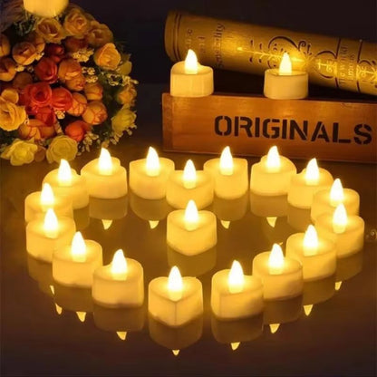Bougie LED Chauffe Plat Cœur, allumées et disposées en coeur sur une table. 