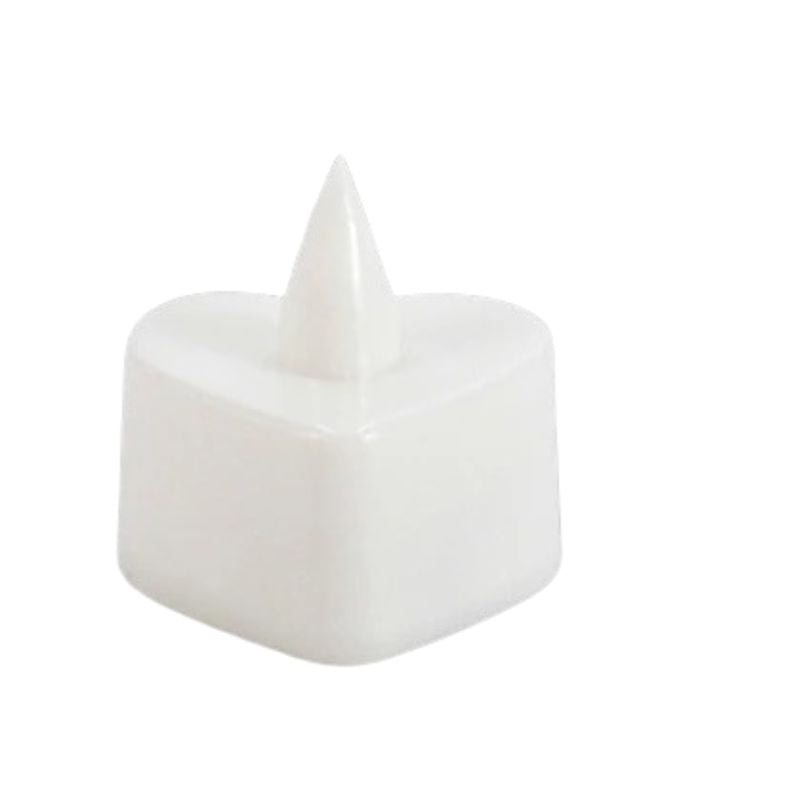 Bougie LED Chauffe Plat Cœur, éteinte et sur fond blanc.