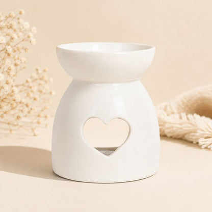 Brule Parfum Cœur Blanc en céramique blanche au design épuré sur fond beige clair, décoration minimaliste pour fondants parfumés.