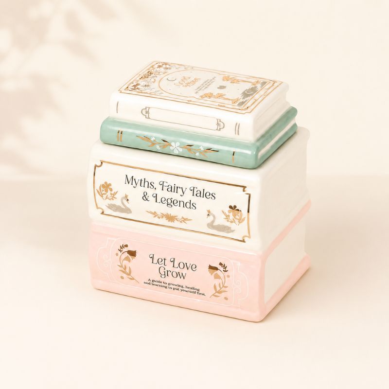 Brule Parfum Livre des Merveilles en céramique, diffuseur pour fondants parfumés au design livre, décoration romantique et élégante.