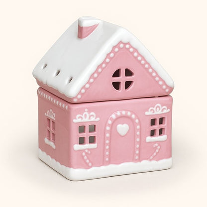 Brule Parfum Maison Pain D'Épices Rose, de couleur rose et blanche, sur fond beige clair.