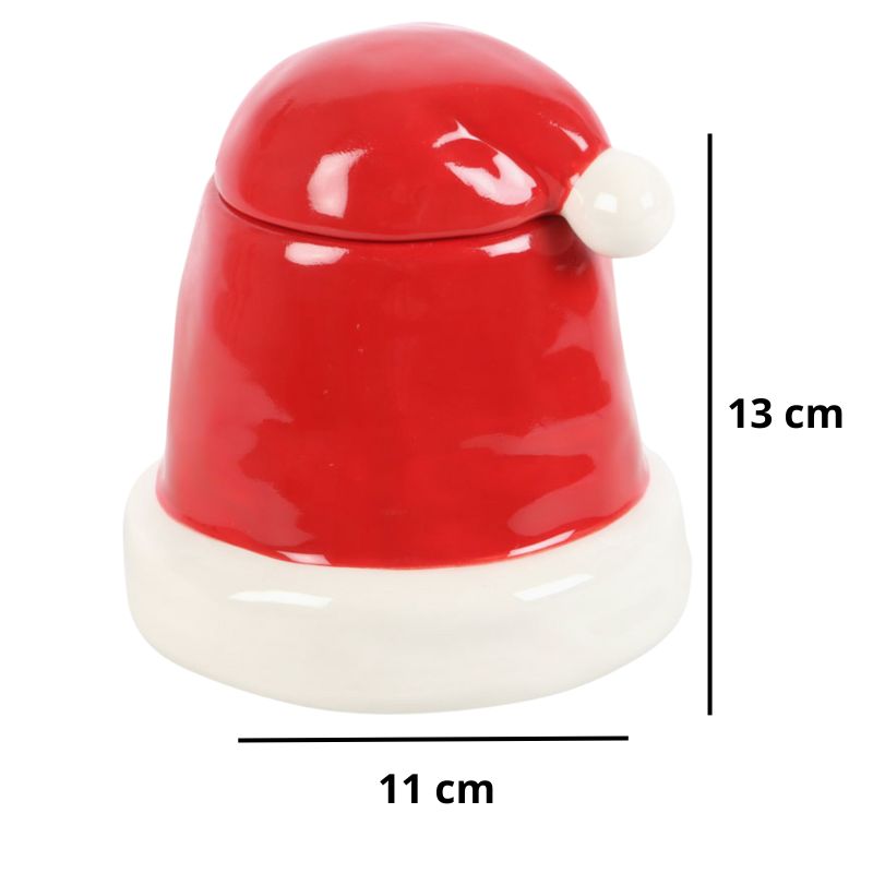 Brule Parfum Noël Rouge Magique, avec ses dimensions, sa couleur rouge, sa forme de bonnet du père Noël et sur fond blanc.