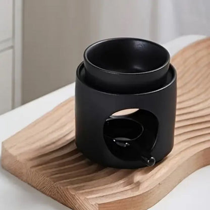 Brule Parfum Noir Design avec coupelle amovible pour fondant parfumé et bougie chauffe-plat.