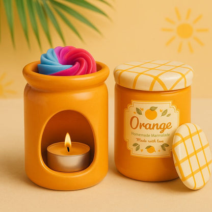 Brule Parfum Pot Délice d'Agrumes, orange avec bougie chauffe-plat et fondant parfumé coloré, style pot de marmelade dans une ambiance ensoleillée. 