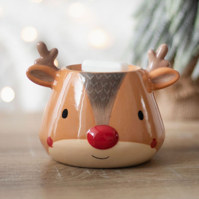 Brule Parfum XL Renne Enchanté de Noël, posé sur une table en bois clair et avec un fondant parfumé blanc. Ambiance zen.