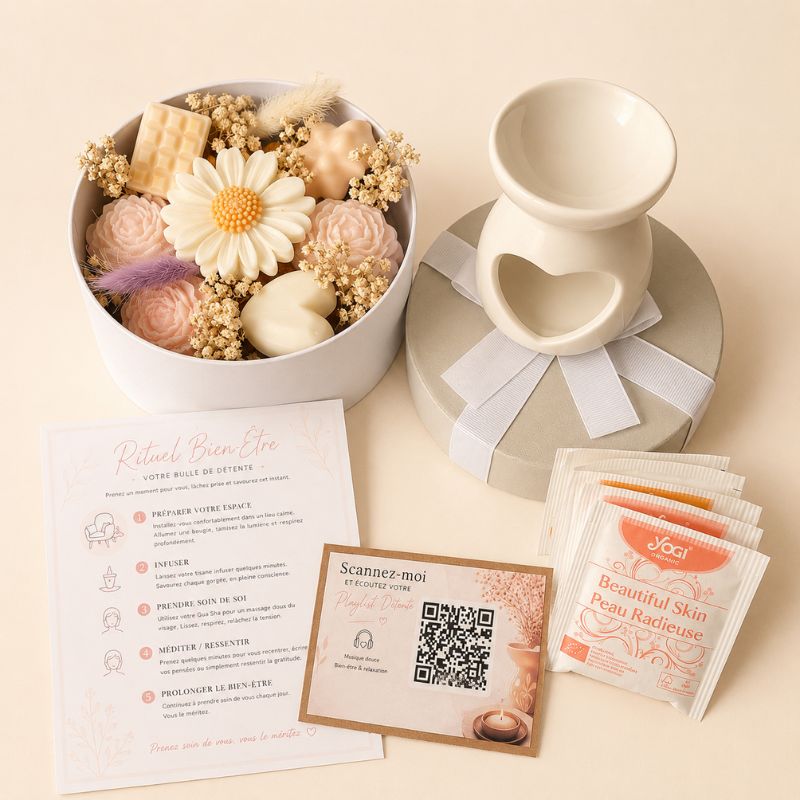 Coffret Bougie Cadeau – Pause Bien-Être avec brûle-parfum en forme de cœur, fondants parfumés floraux, tisane relaxante et rituel cocooning apaisant. Sur fond beige clair.
