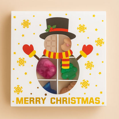 Coffret Édition Limitée Fondant de Fête, la boite est en forme de bonhomme de neige et sur fond beige clair.