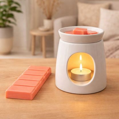 Fondant Parfumé Clémentine Monoï Snapbar dans brûle parfum avec bougie ambiance douce et relaxante décoration intérieure.