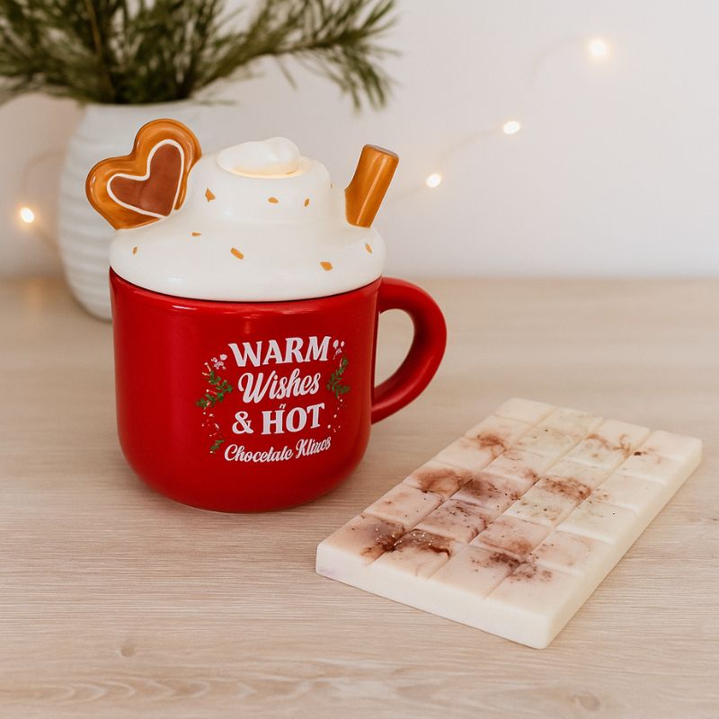 Fondant Parfumé Tablette Rocher Praliné, la tablette est disposée à côté d'un brûleur de Noël, dans une ambiance scandinave.