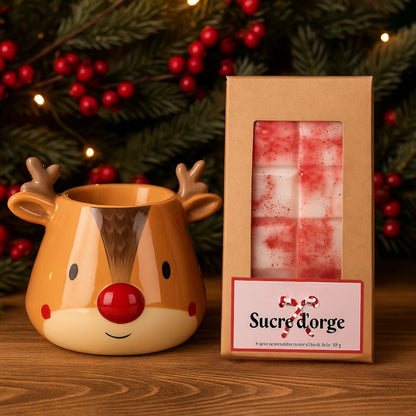 Fondant Parfumé Tablette Sucre d'Orge, disposée à côté d'un brûleur en forme de renne et dans une ambiance festive.
