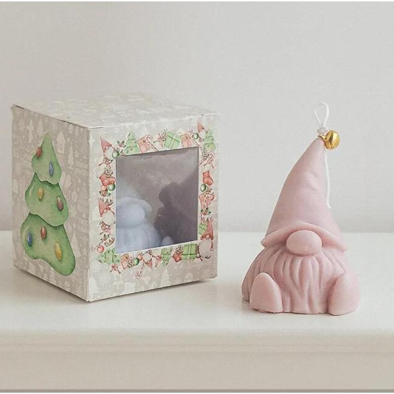 Bougie Décorative Gnome et de couleur rose.