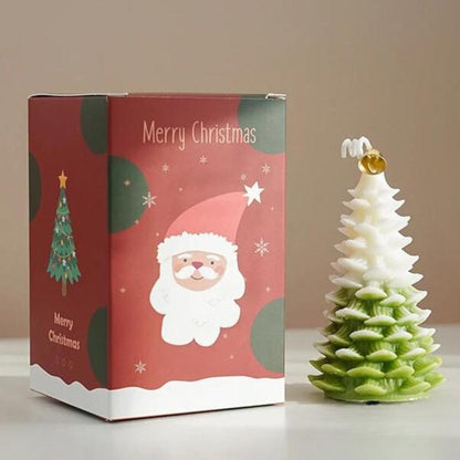 Bougie Noël Magique et Sapin Senteur d’Hiver, de couleur blanche et verte, avec sa boite de protection.