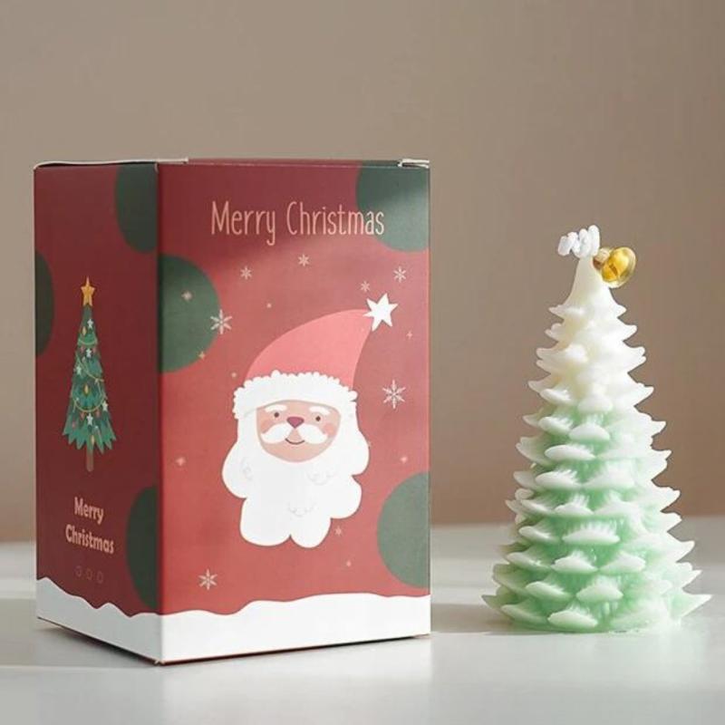 Bougie Noël Magique et Sapin Senteur d’Hiver, de couleur blanche et verte, avec sa boite de protection.