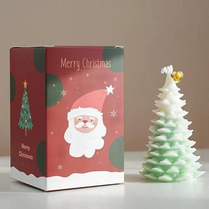 Bougie Noël Magique et Sapin Senteur d’Hiver, de couleur blanche et verte, avec sa boite de protection.